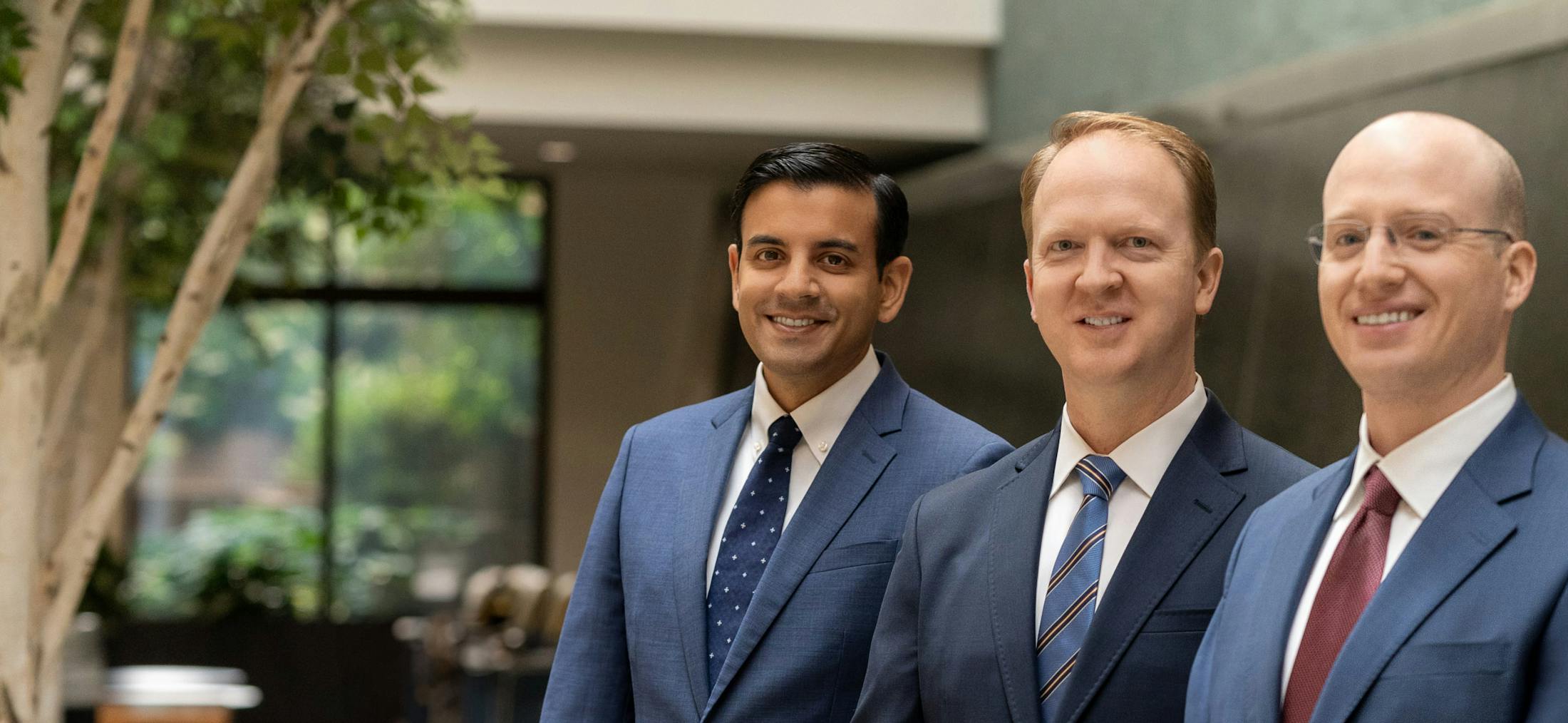 Three doctors at Virginia Neurosurgeons smiling