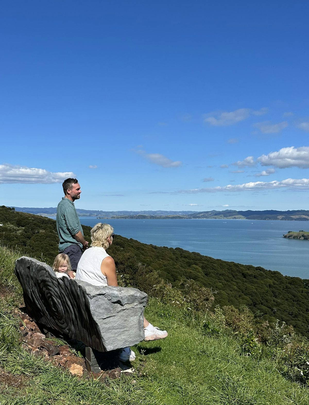 A beautiful hand-carved stone bench looking out over the sea.
