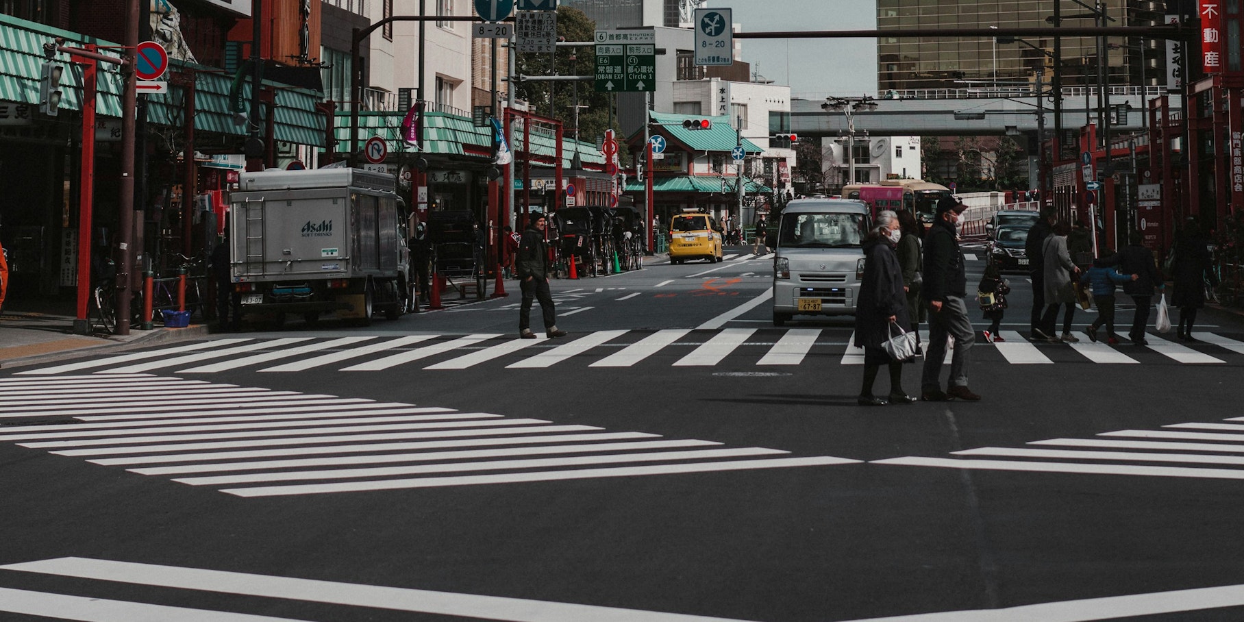 Cars and City cars parked on street near high tower