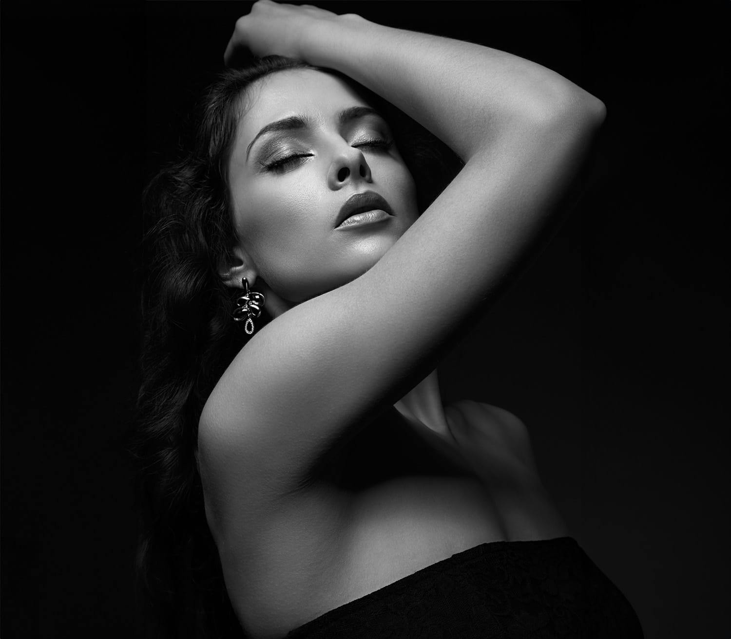 woman with her arm over her head