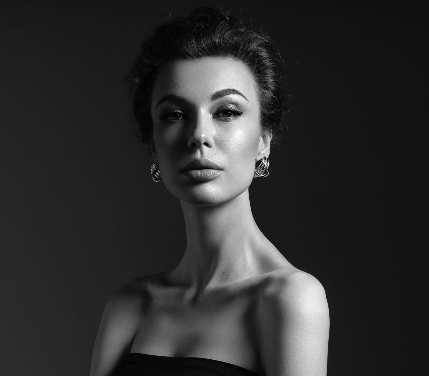 upper half of woman looking into camera