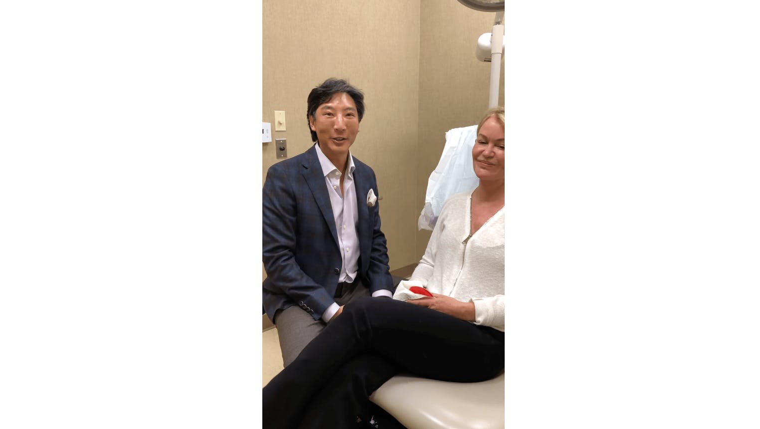 Dr. Gilbert Lee with a patient