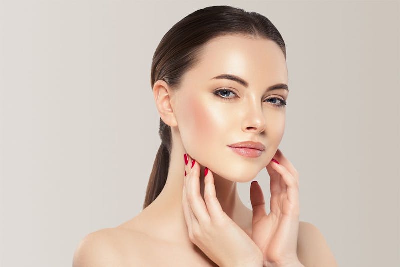 Woman with her hands on her face