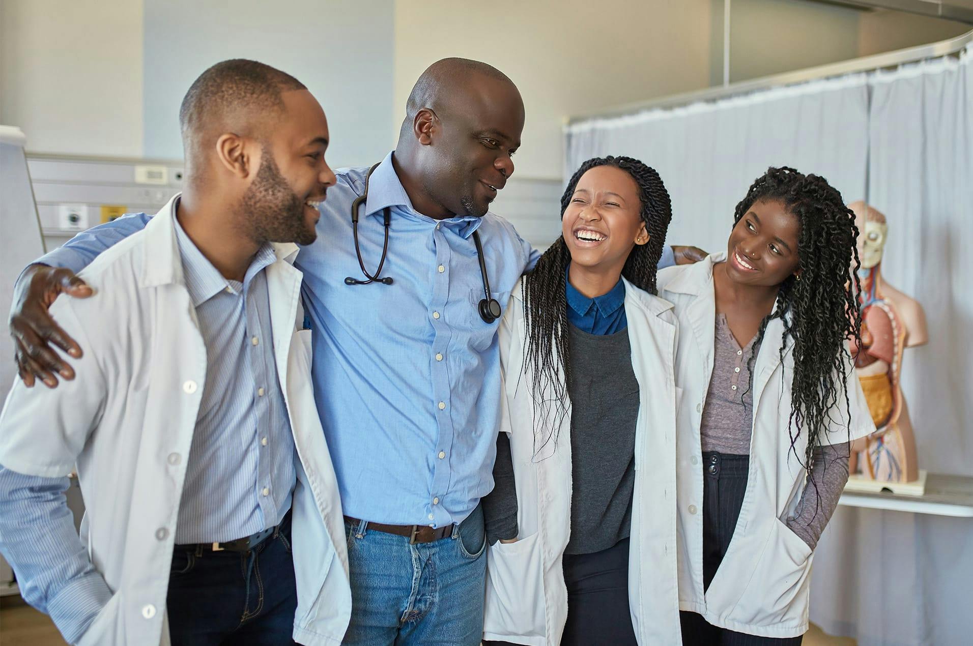 doctor and nurses having group hug