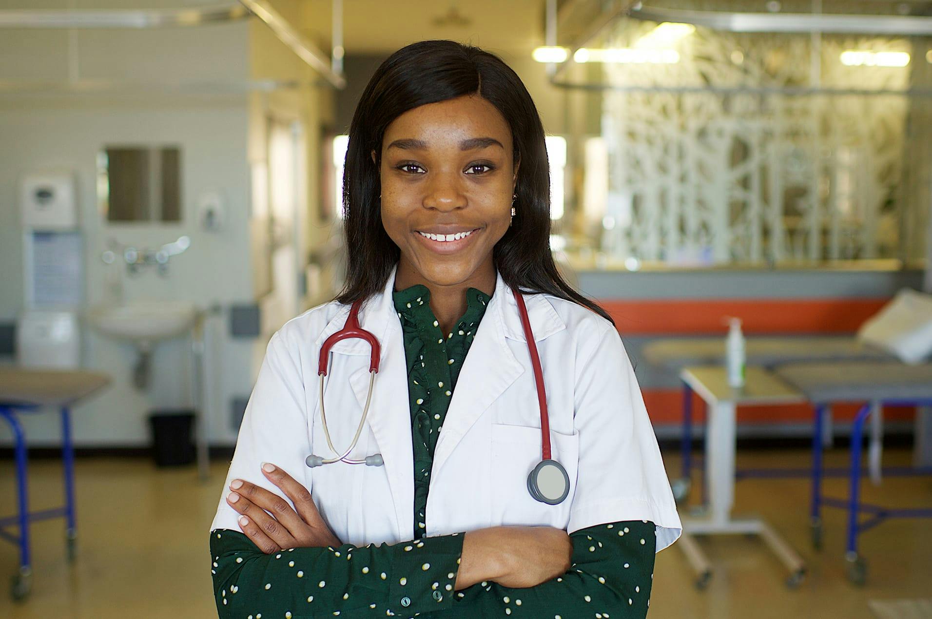 nurse smiling and crossing her arms