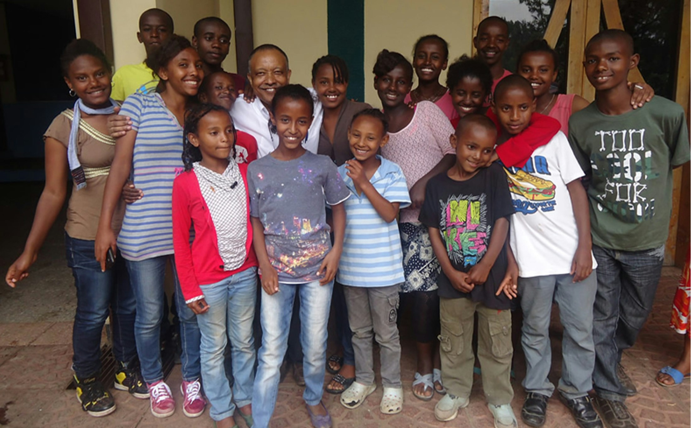group of kids smiling for group photo