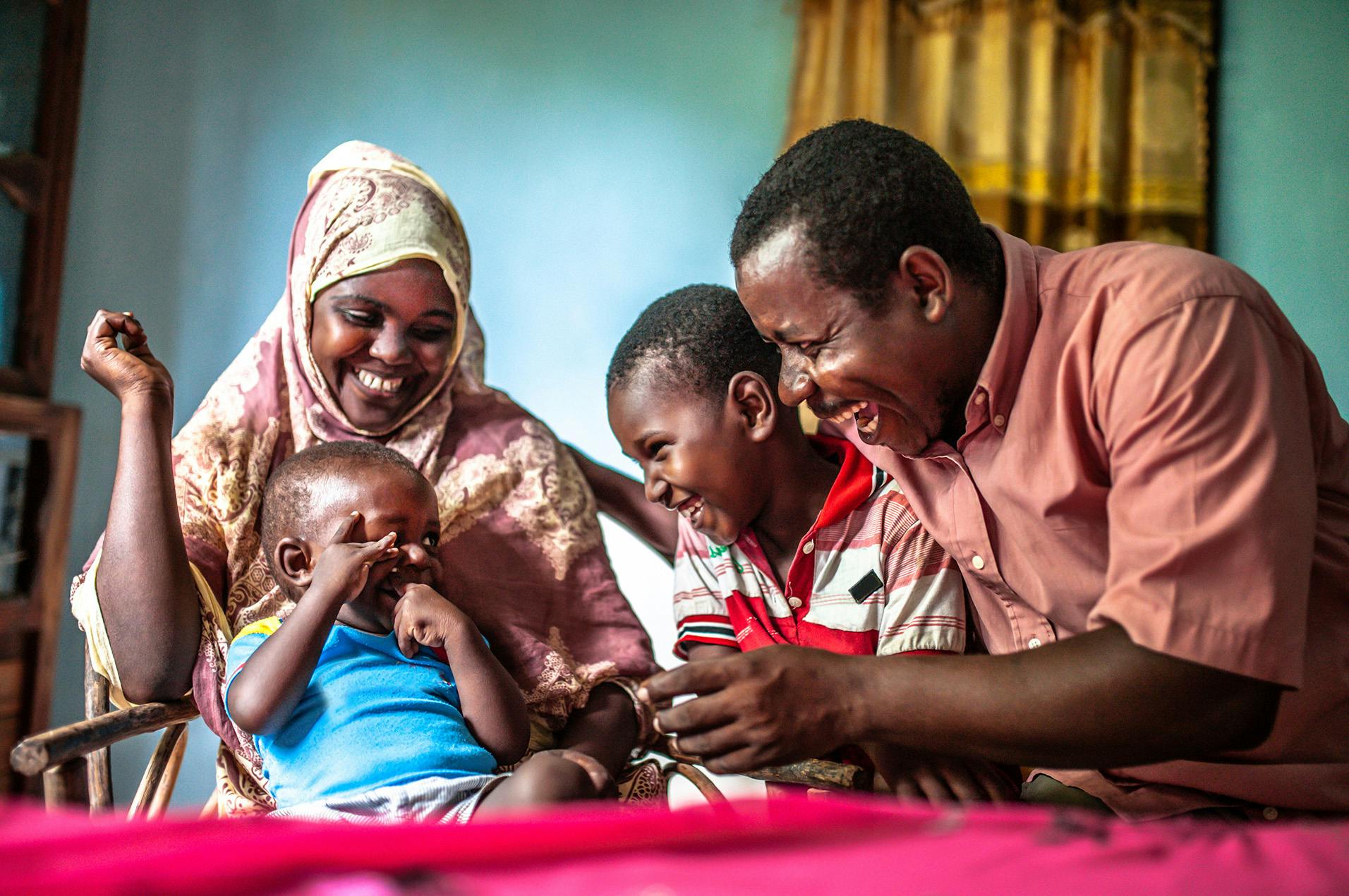 family of 4 smiling together