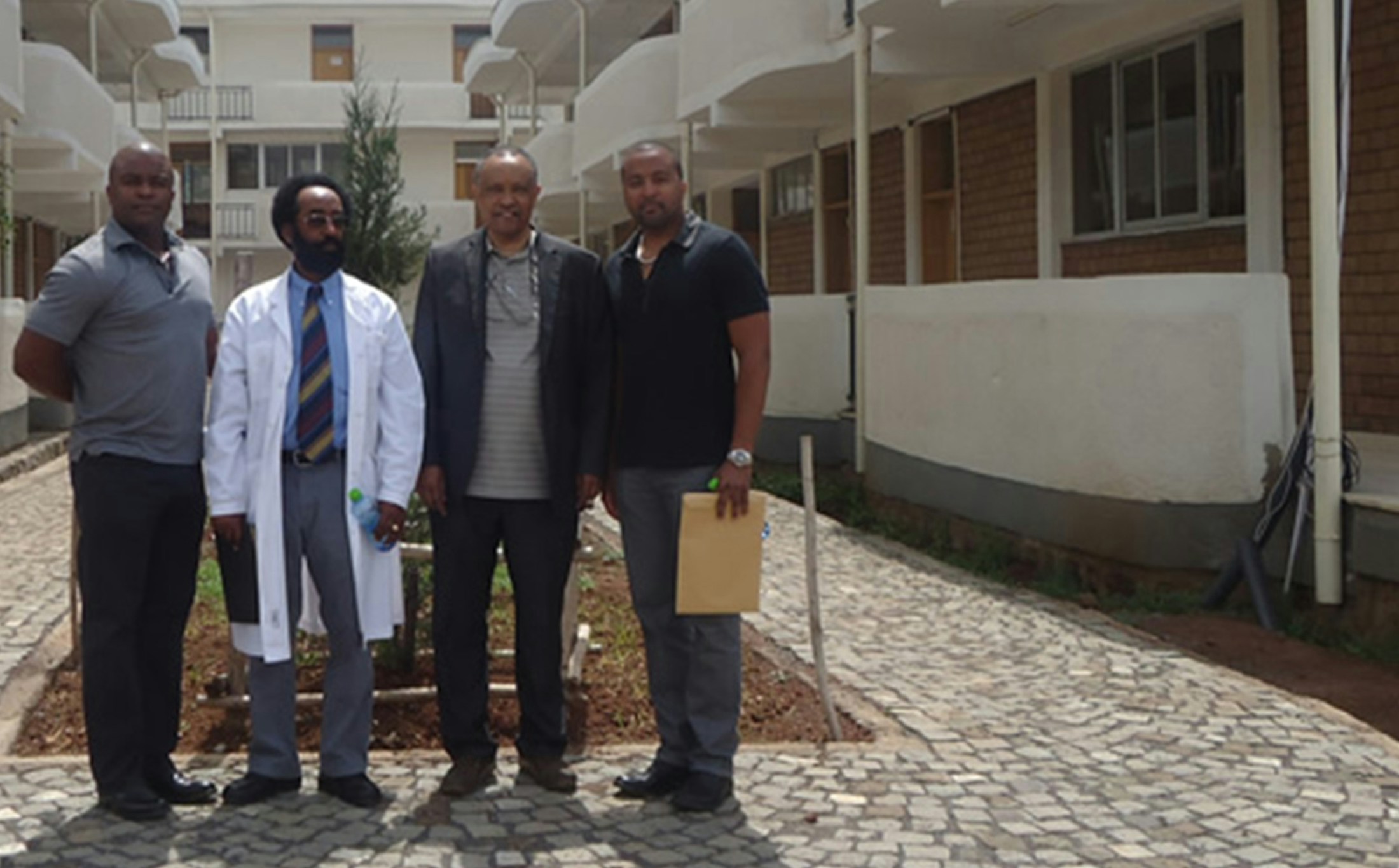 doctors standin out of building