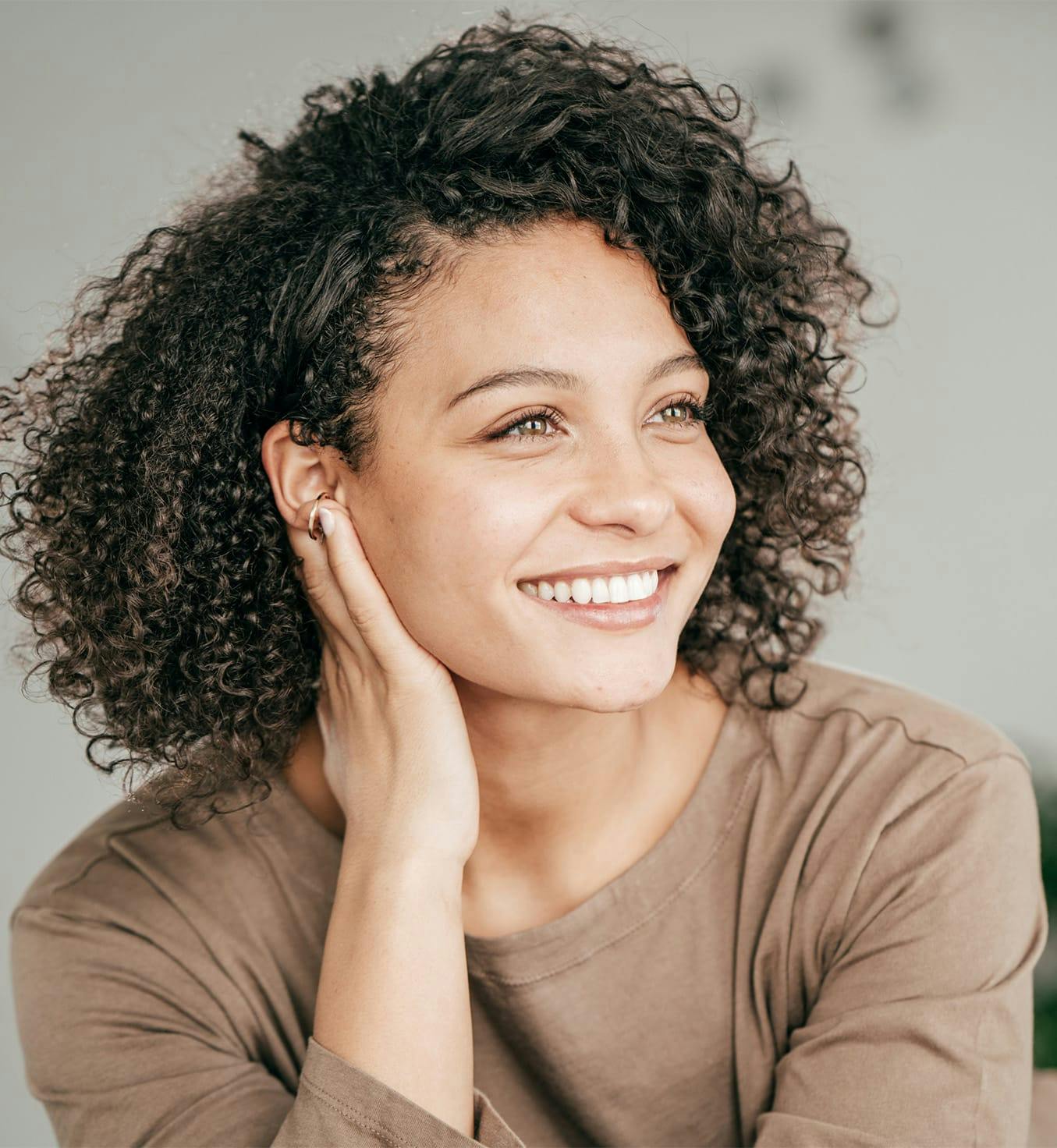 Woman with curly hair smiling