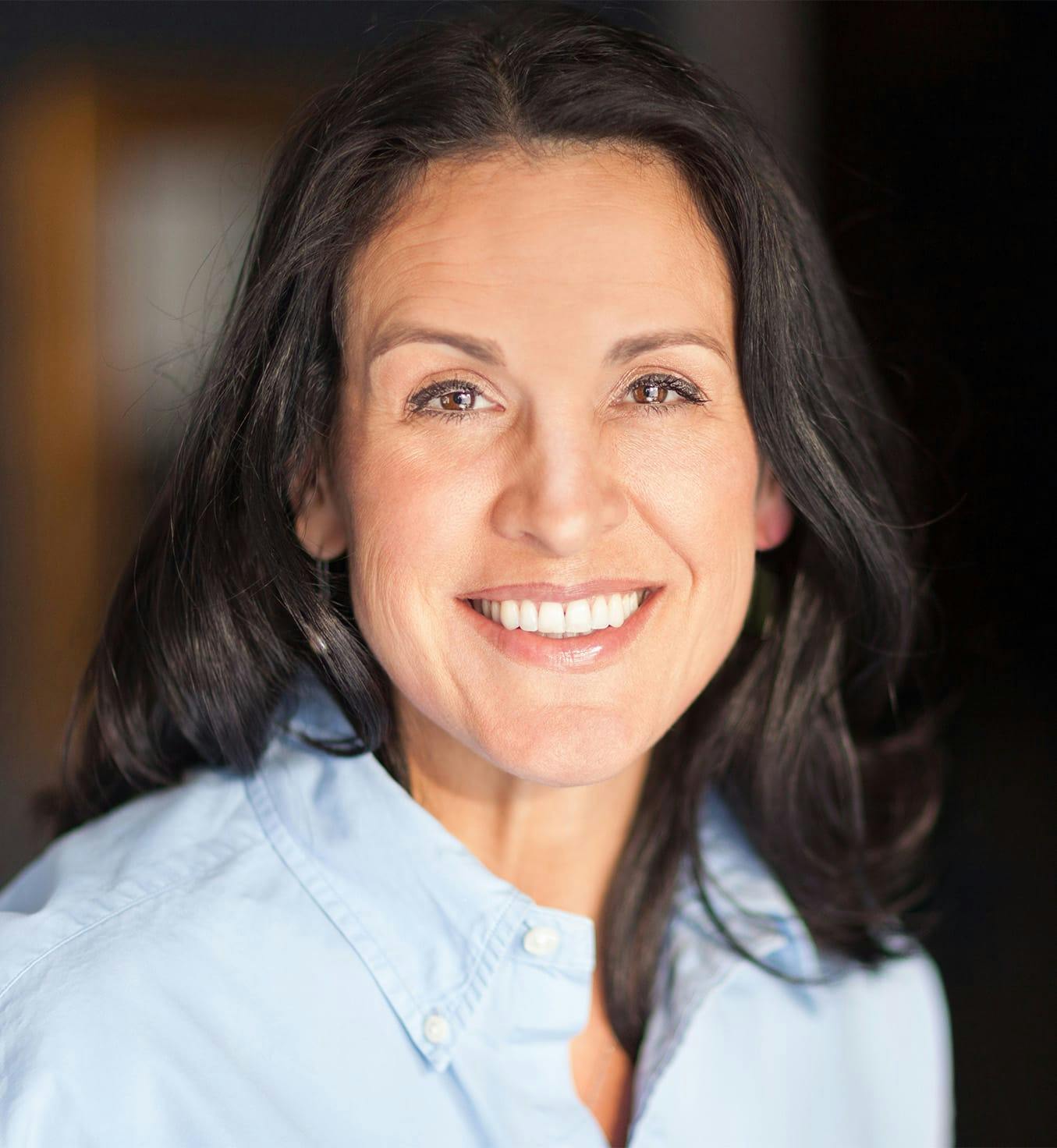 Woman with black hair smiling