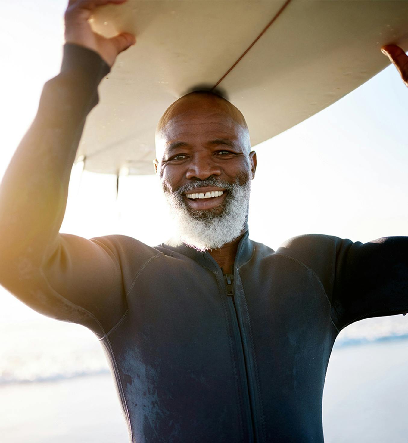 Man carrying a surf board