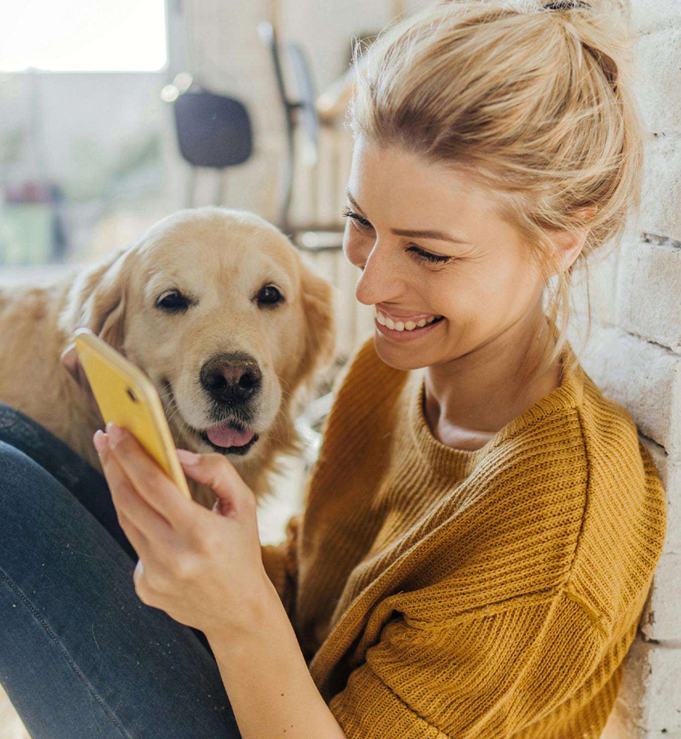 Woman sitting down with dog