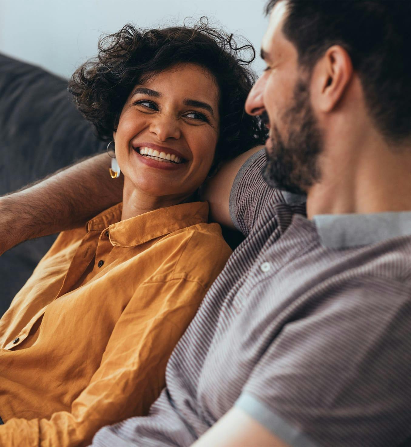 Woman smiling at man