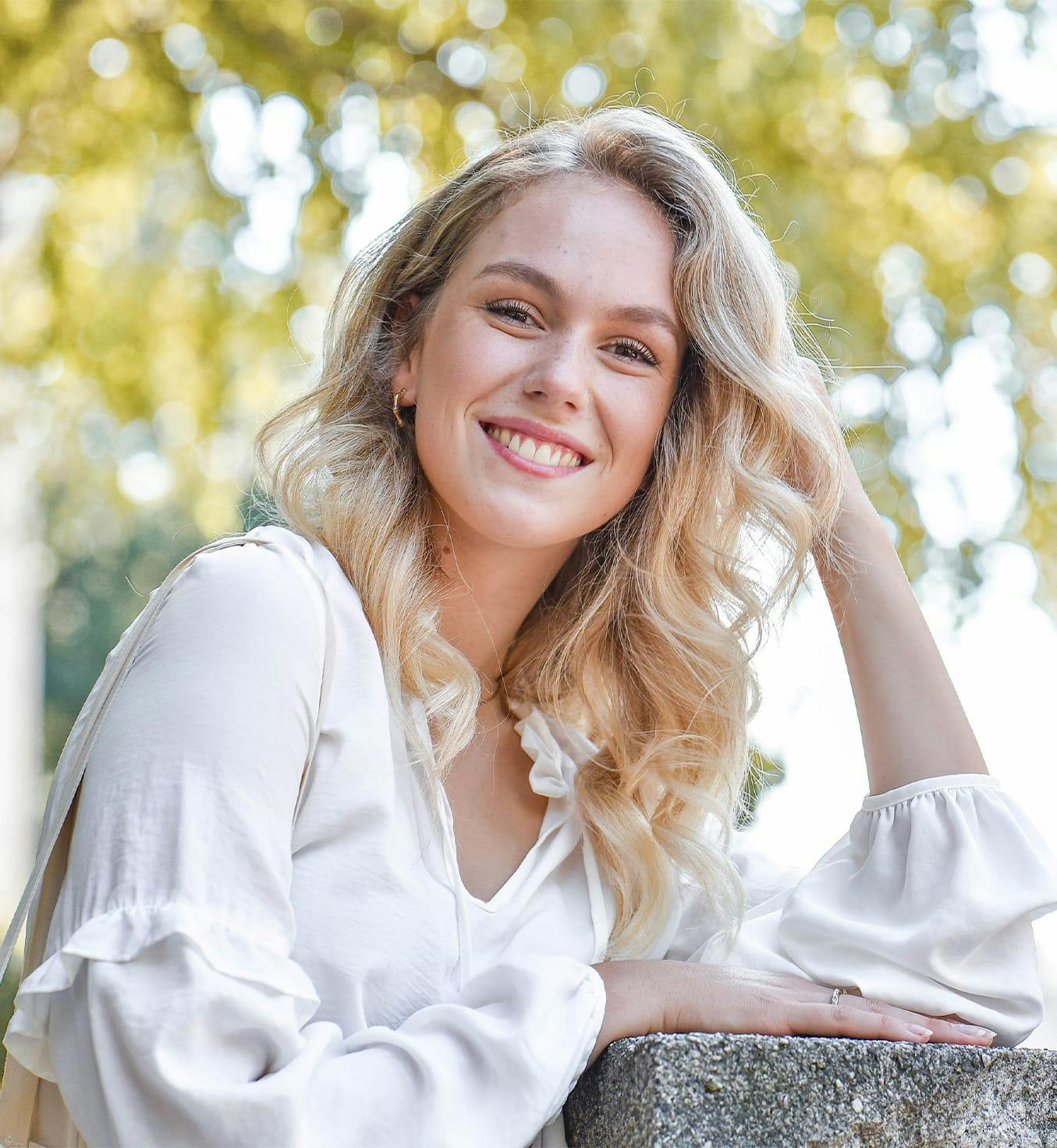 Woman with blonde hair smiling