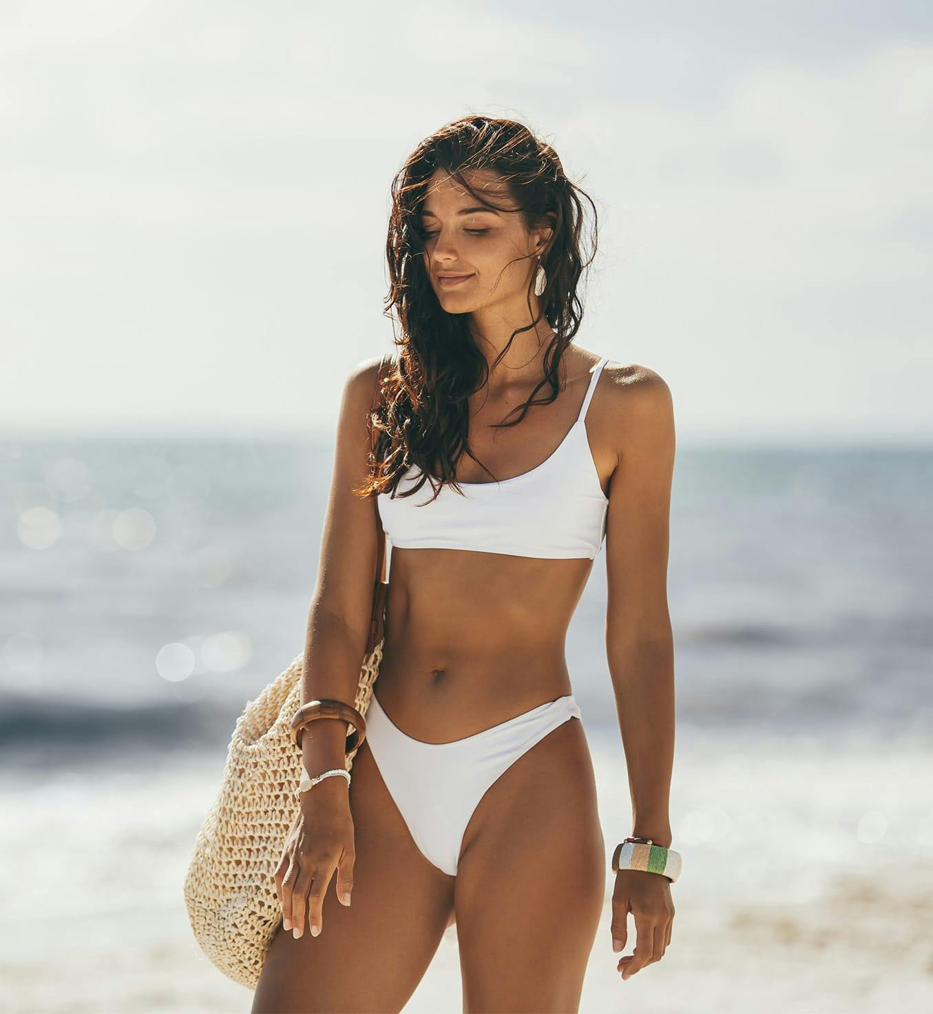 Woman wearing a white bathing suit