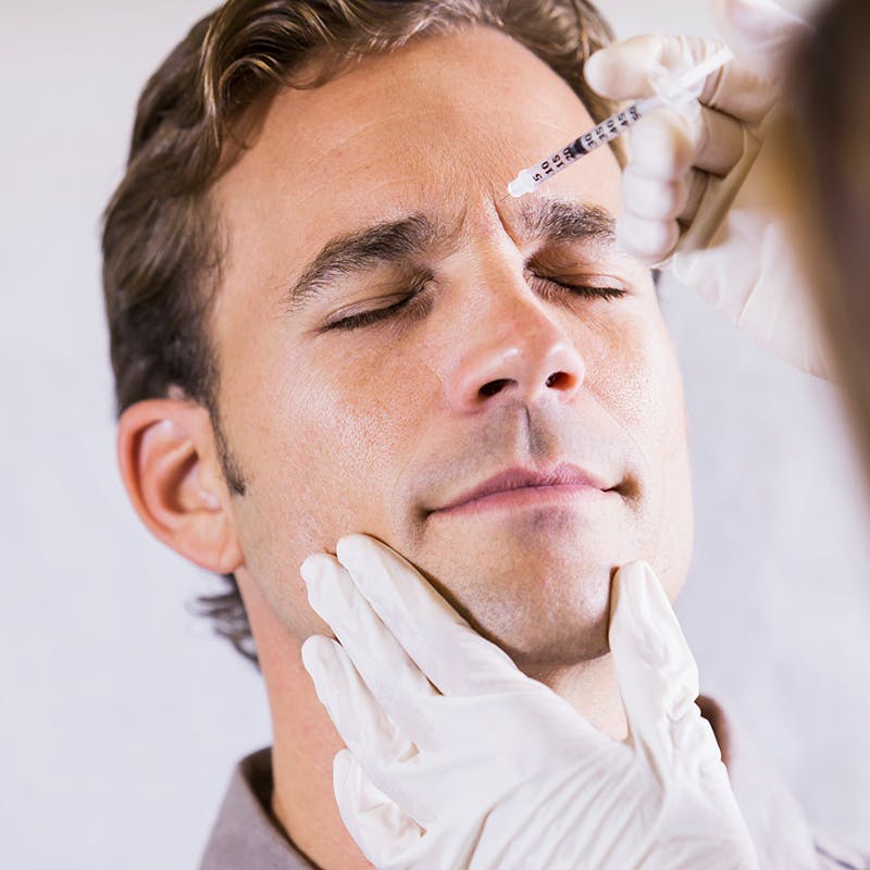 Man receiving BOTOX injection in Tampa, FL