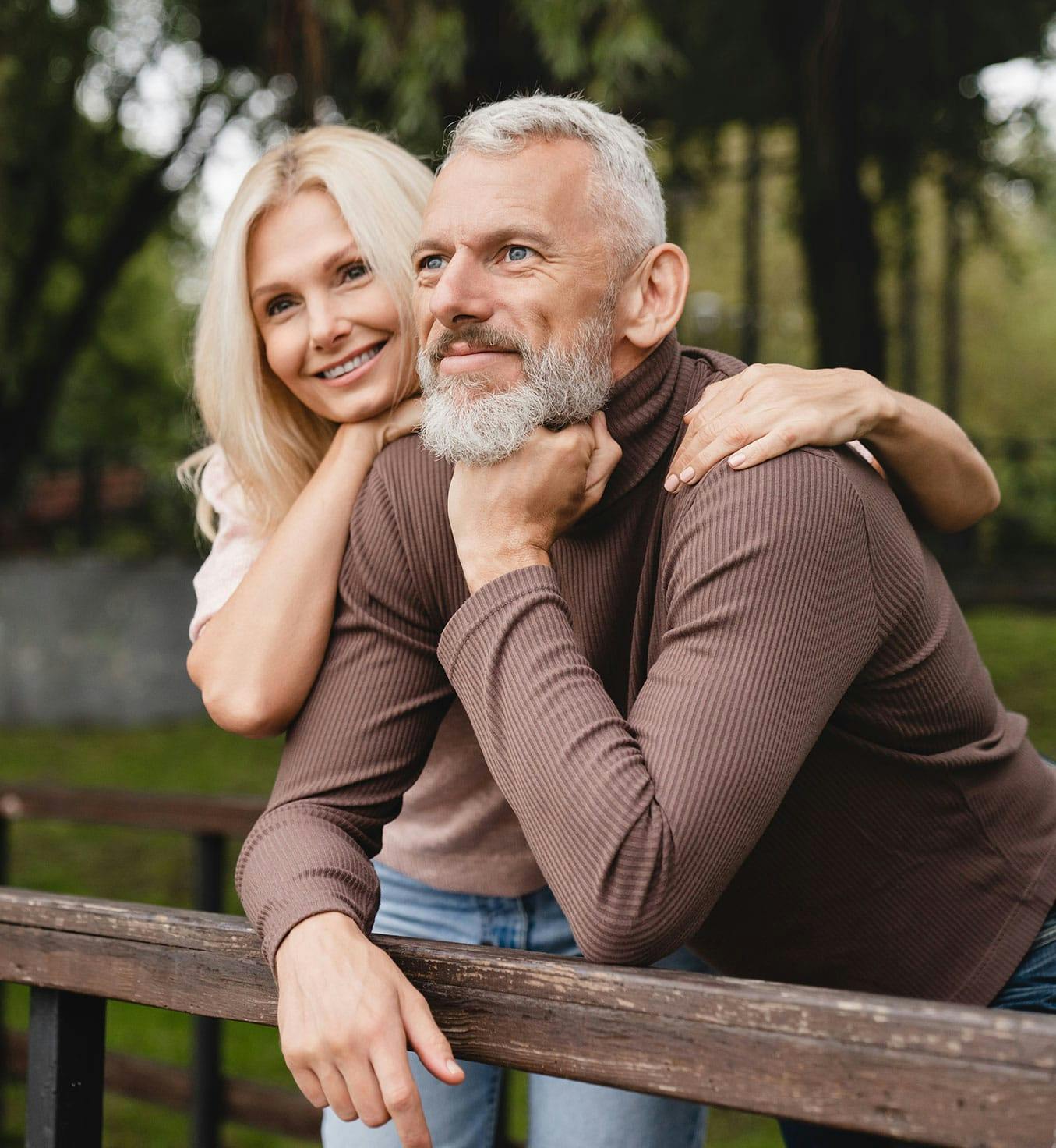 Happy couple outside after hormone therapy from Serotonin Centers.