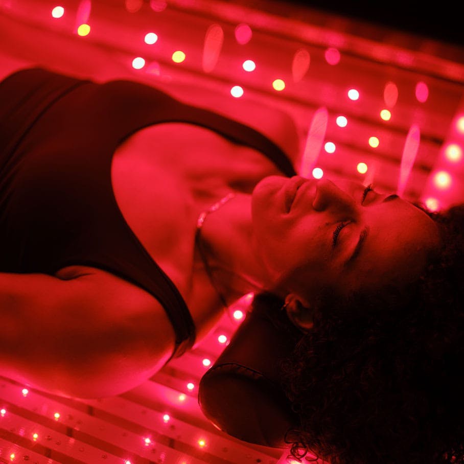 woman receiving red light therapy in a bed in Cherry Hill, NJ