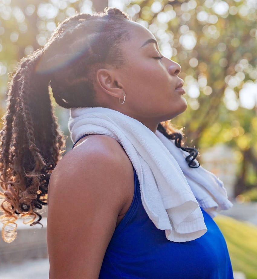 woman jogger taking a break with eyes closed