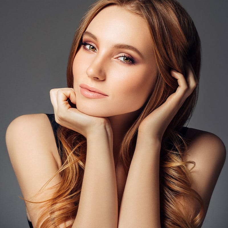 Woman with clear skin after CoolSculpting from Serotonin Centers.