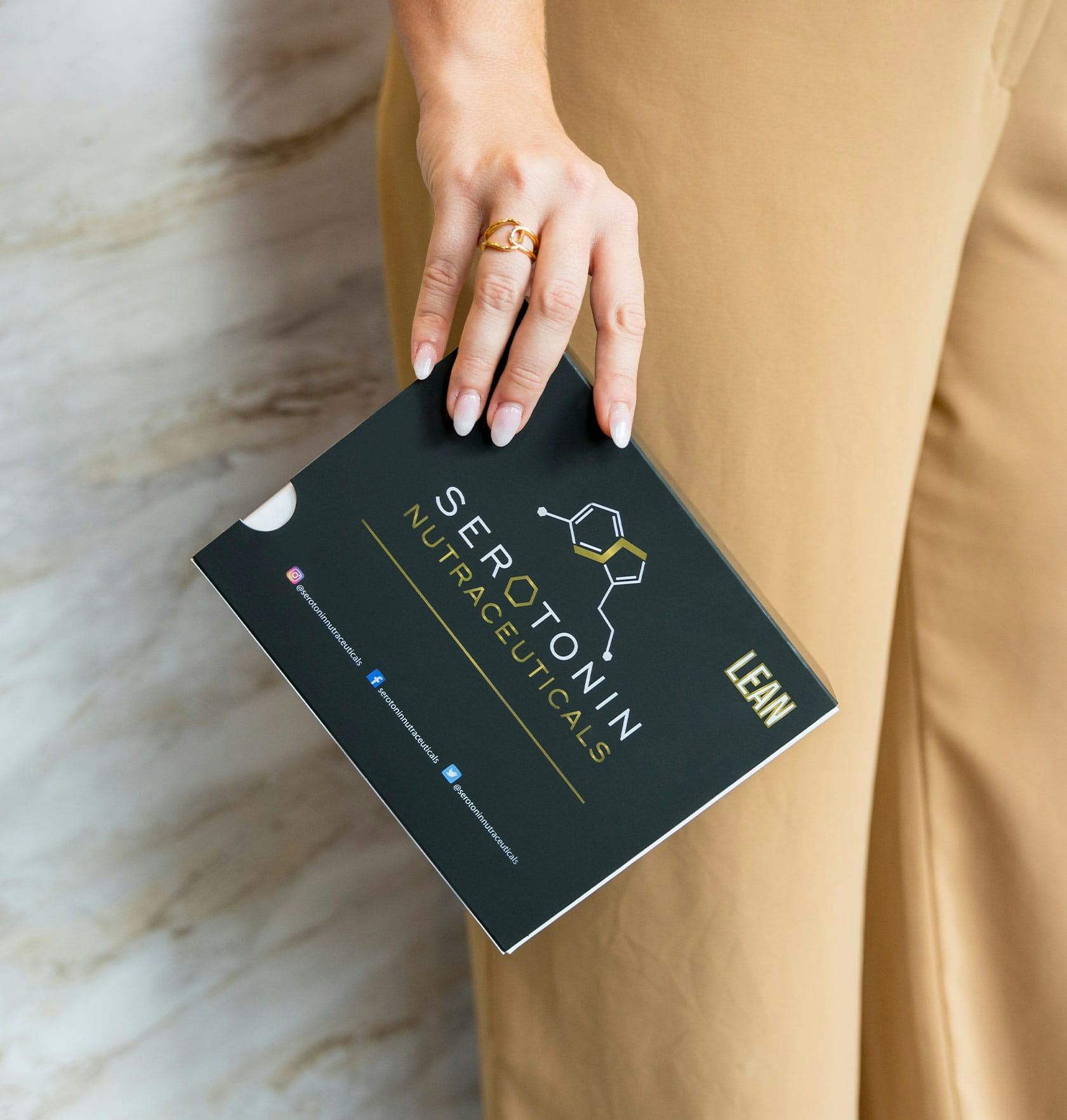 person holding a package of Serotonin Nutraceuticals in Del Mar, CA