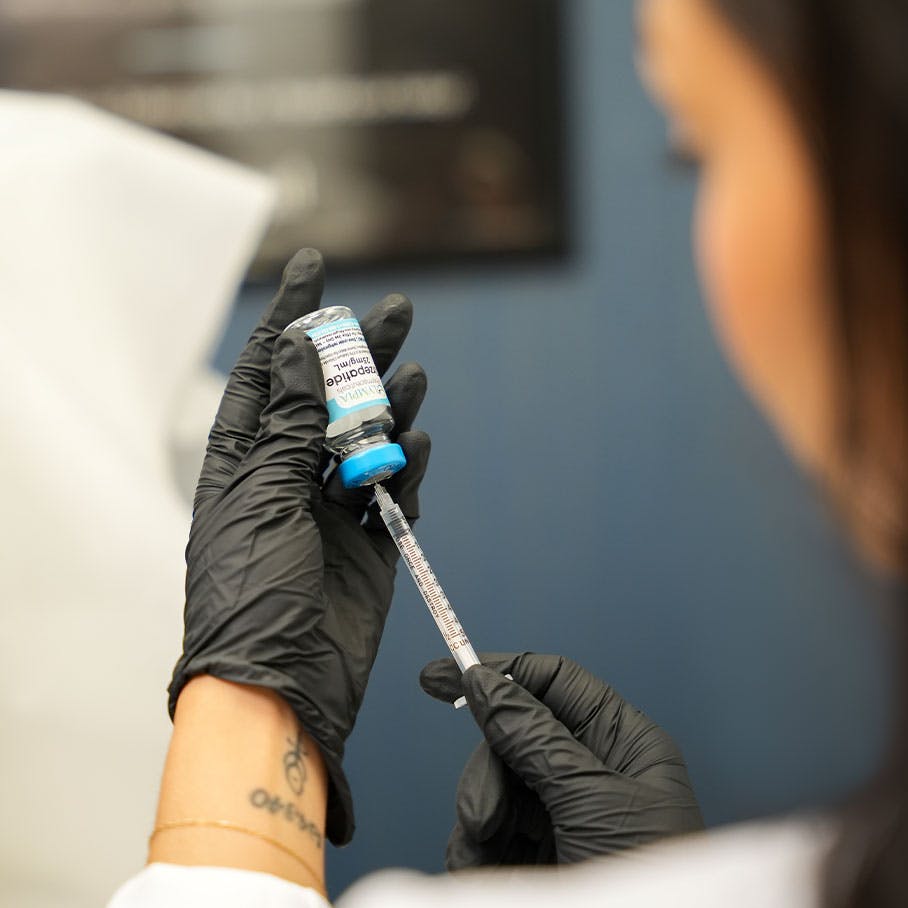 woman preparing weight loss injection in Naperville, IL