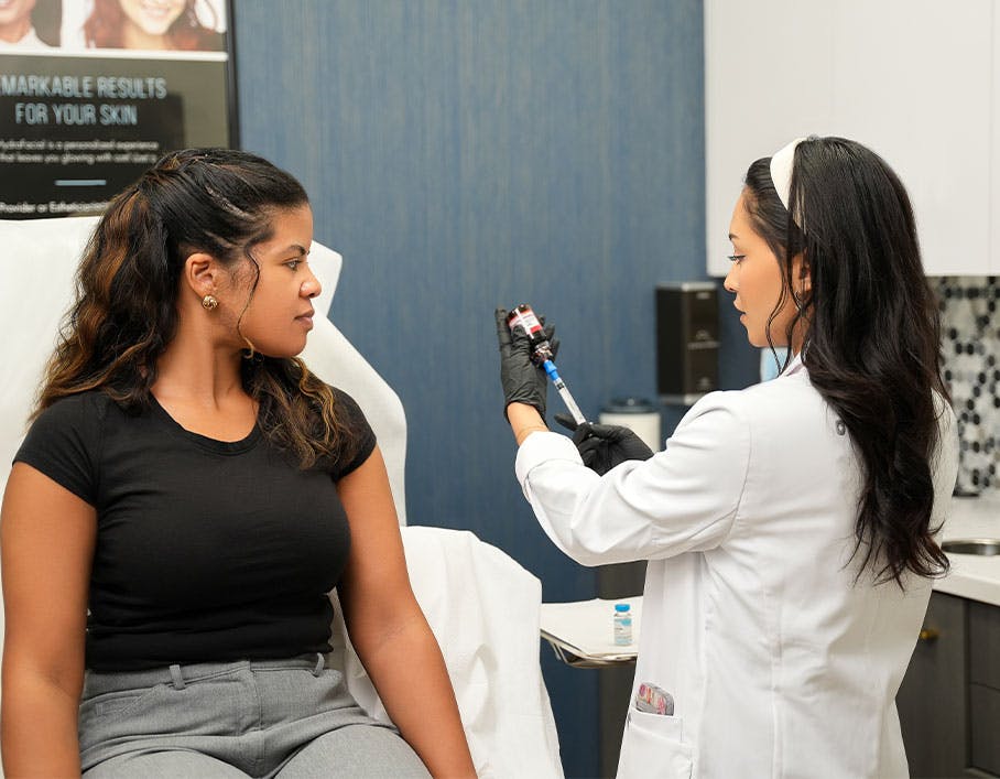 Serotonin Centers team member preparing BHRT injection for patient in Lake Nona, FL