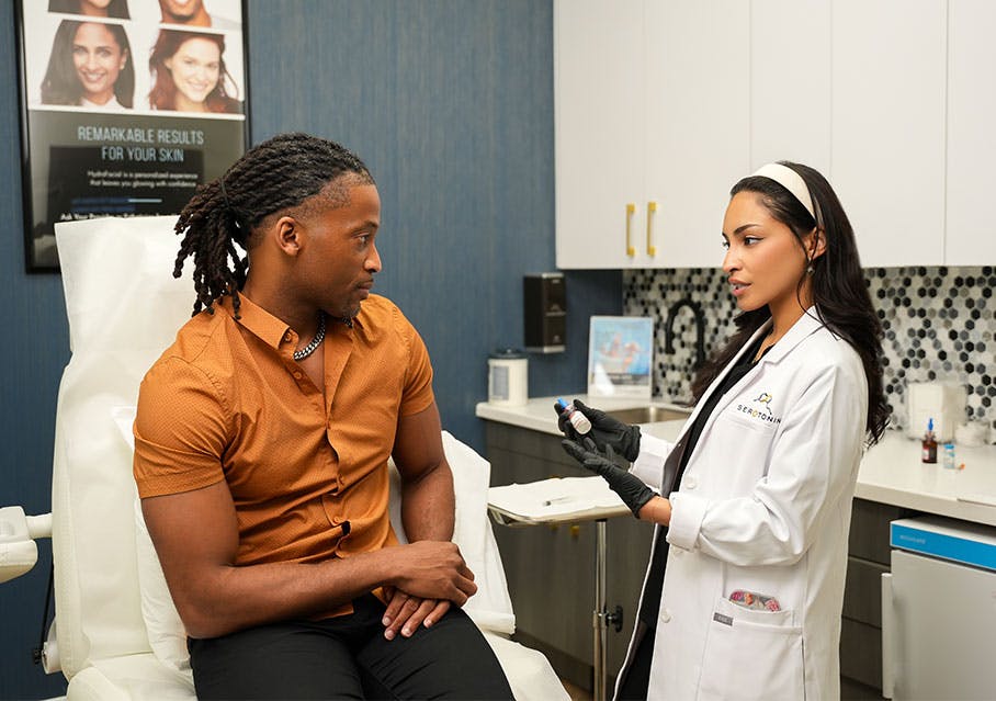 Del Mar patient talking to Serotonin team member about Nad+ therapy