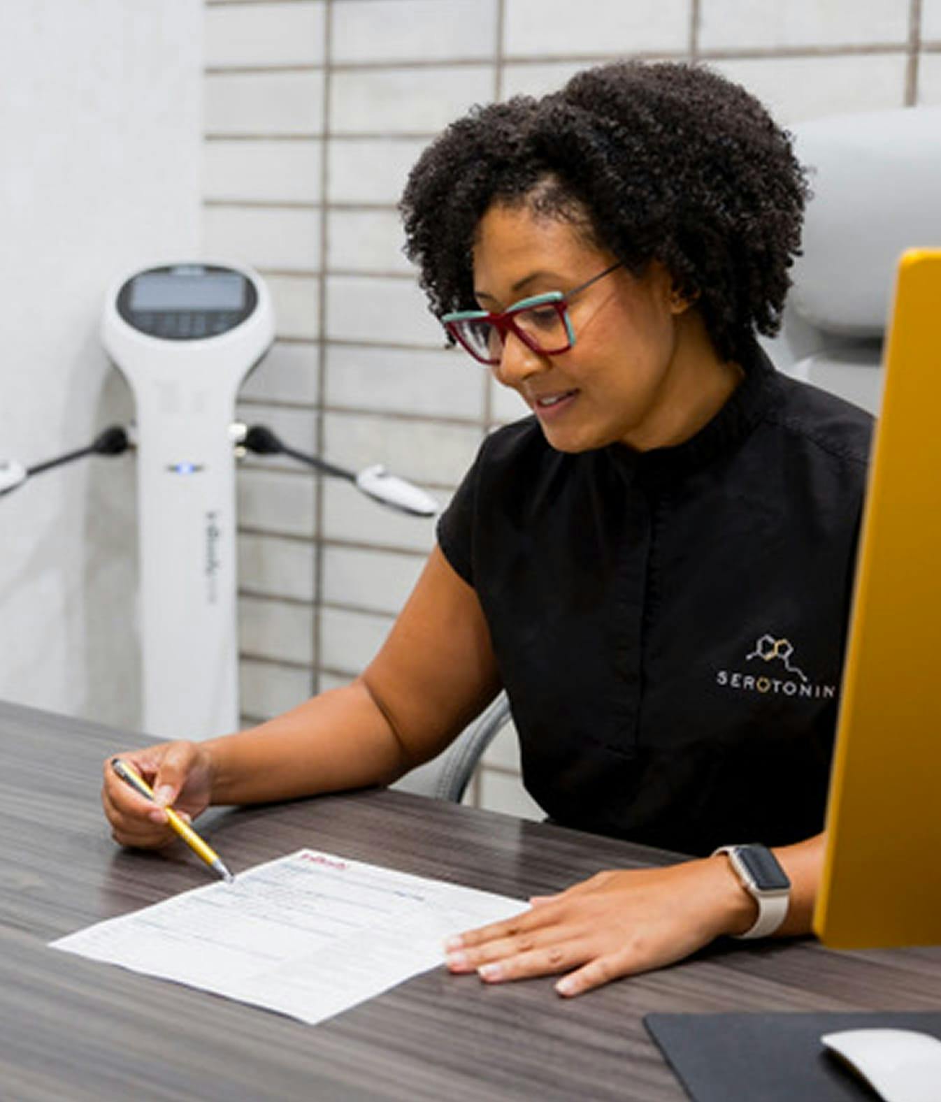 Serotonin Centers Staff looking at a form