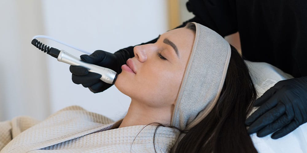 woman receiving aesthetic treatment for healthy skin aging