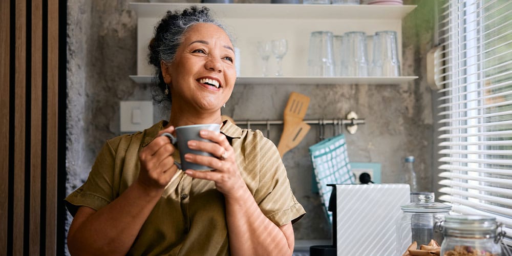 older woman happy after starting hormone therapy