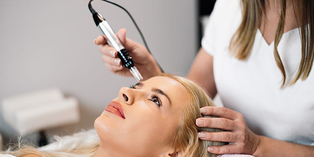 woman getting microneedling treatment