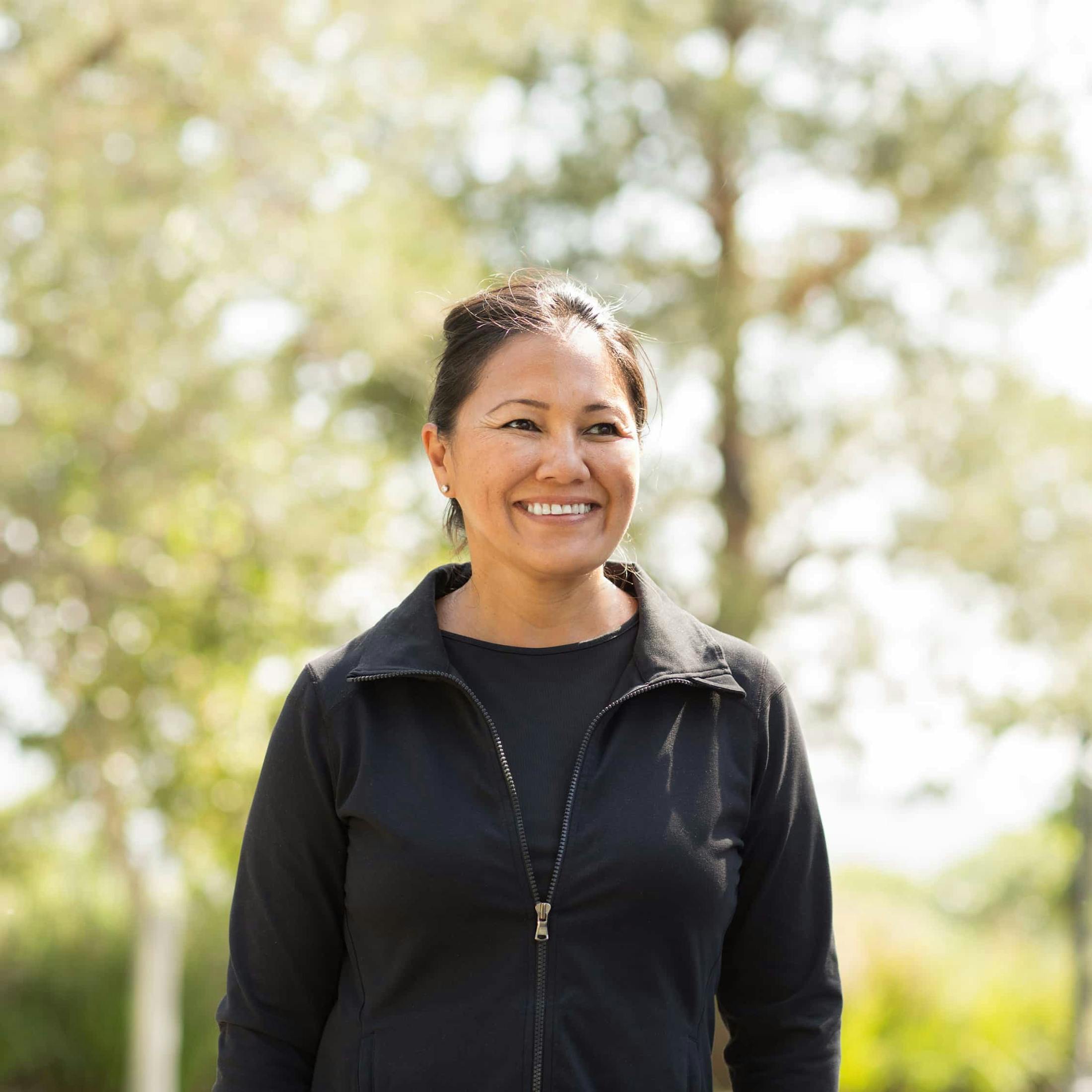 Woman smiling outdoors