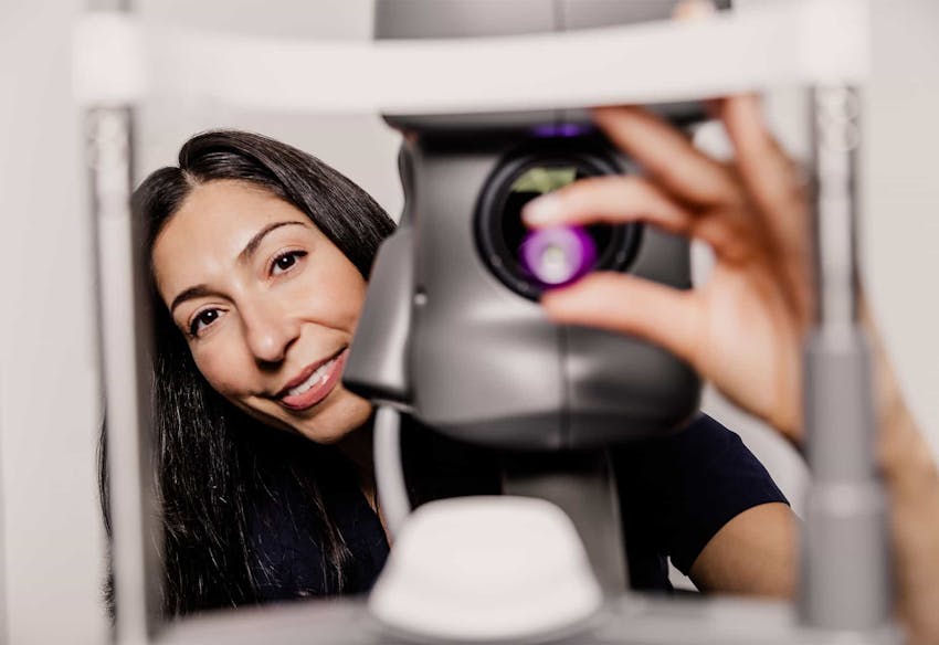 Doctor at eye exam machine