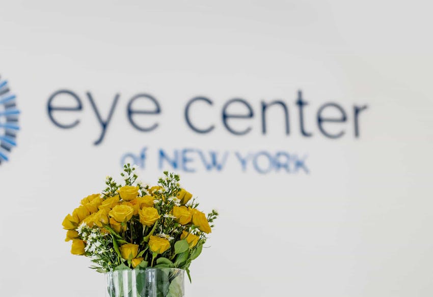 Flowers in front of logo