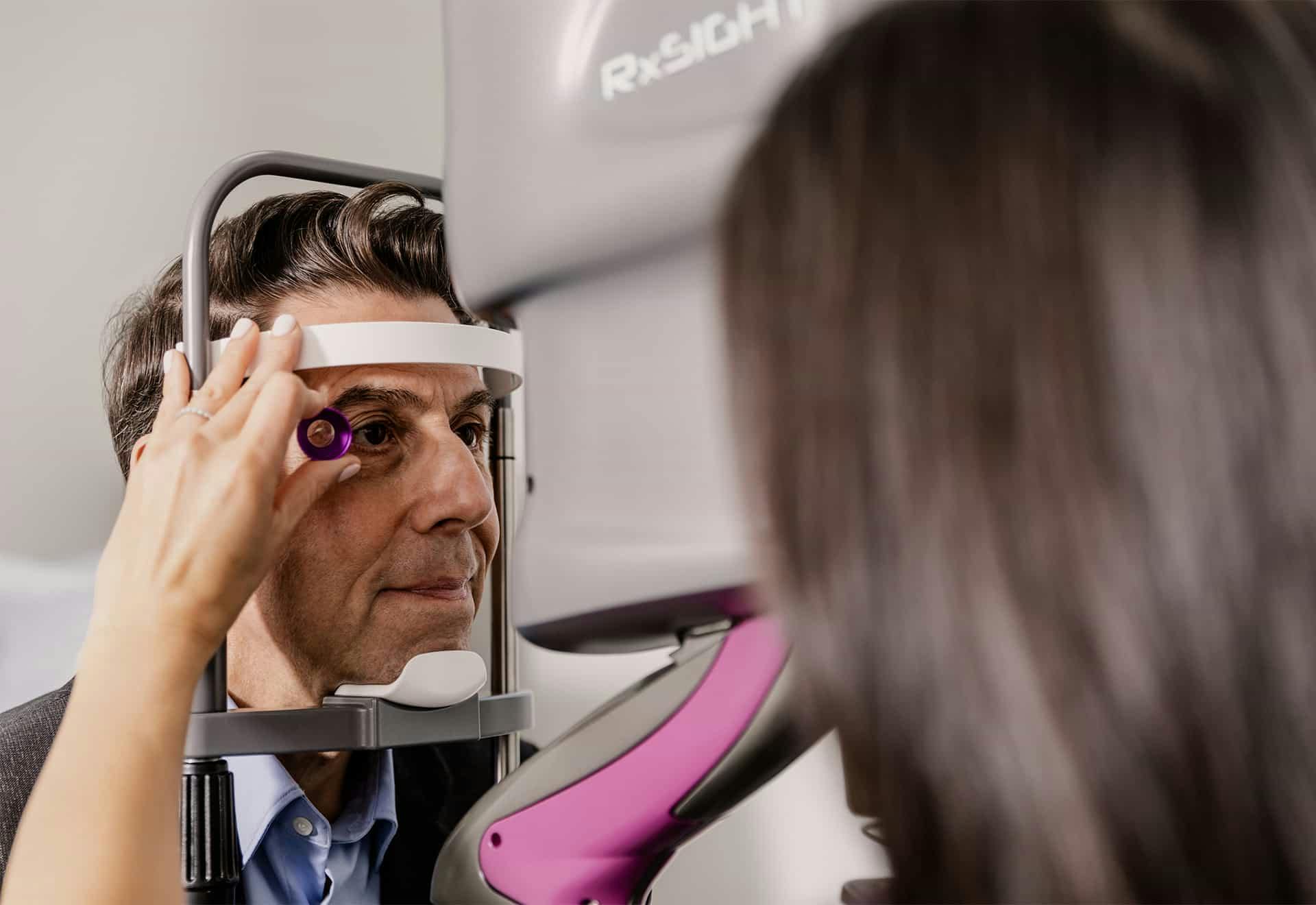 doctor examining patients eyes