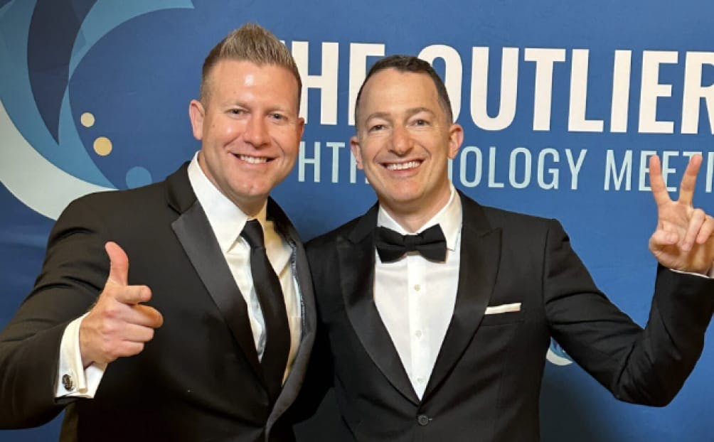 The doctor Standing with a guest at an event