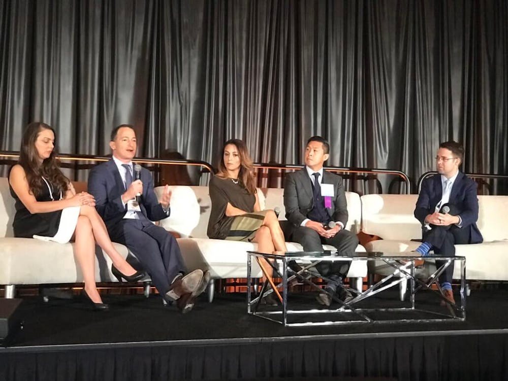 dr raviv sitting on a couch with other people