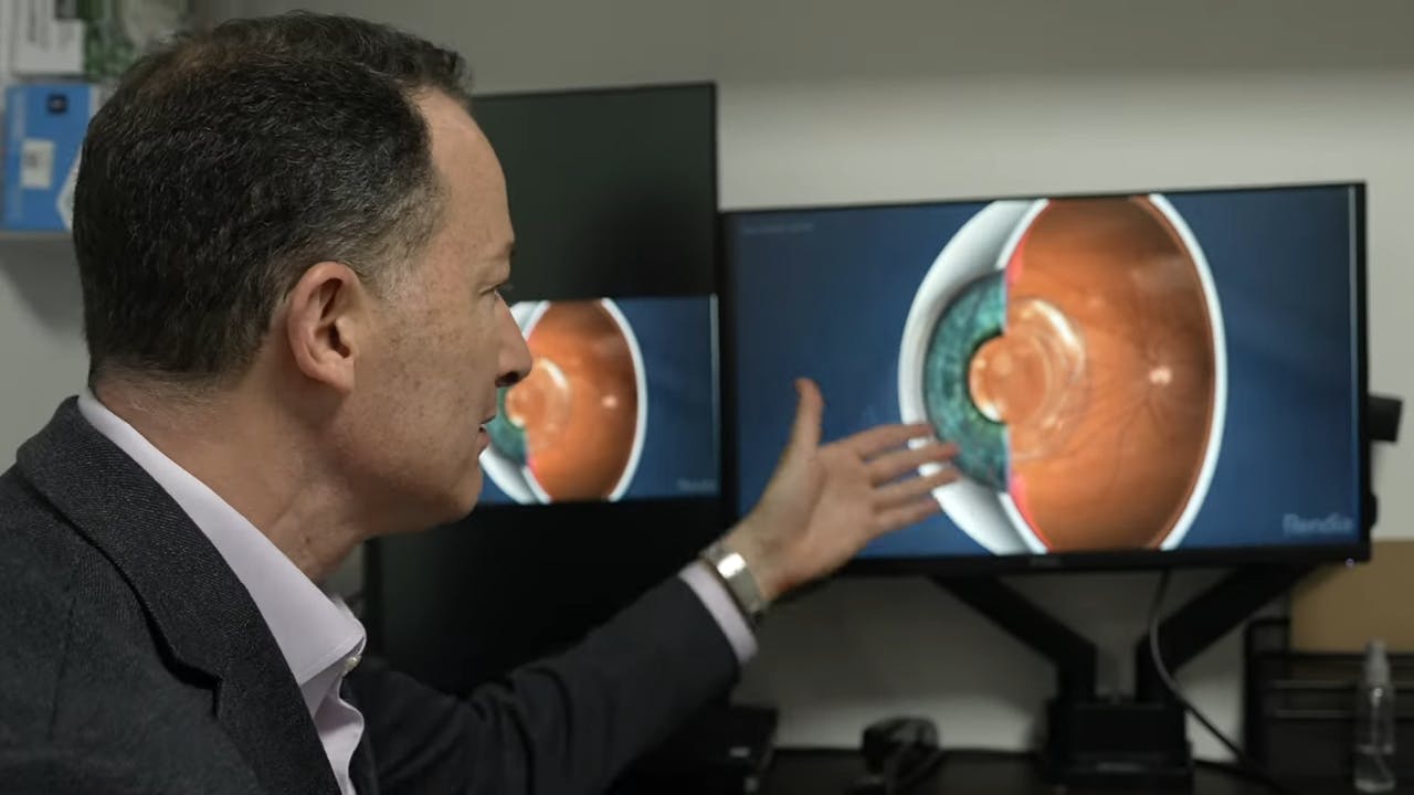 Doctor looking at screen with eye