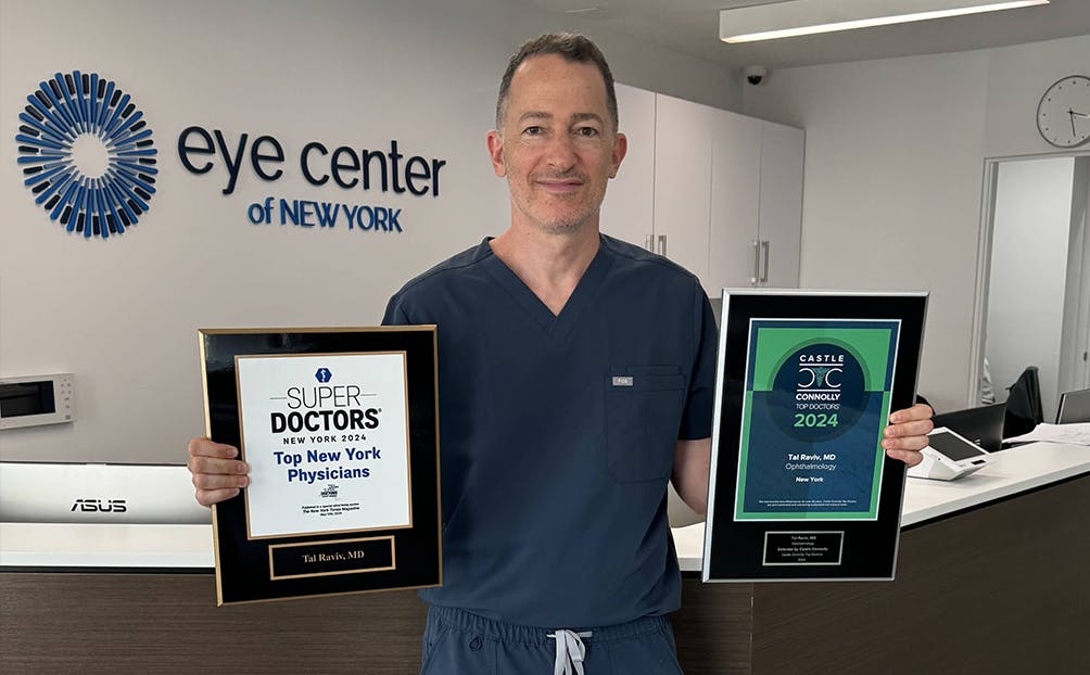The doctor holding his plaques up