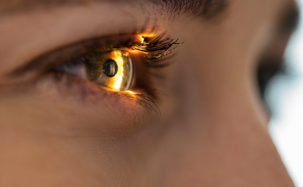 A woman's eye with a light