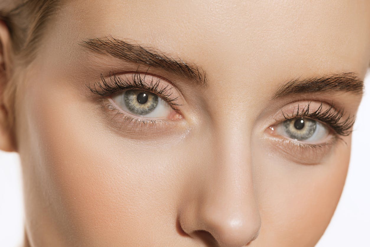 Image of a woman cropped just below her nose and mid forhead to emphasize her beautiful eyes. This is to emulate the topic of vision correction options such as LASIK or iol