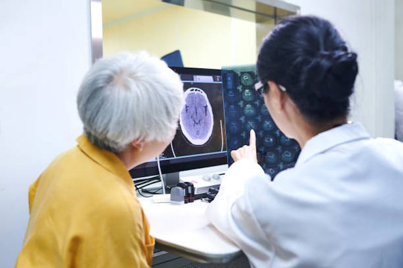 Patient and doctor looking at an image
