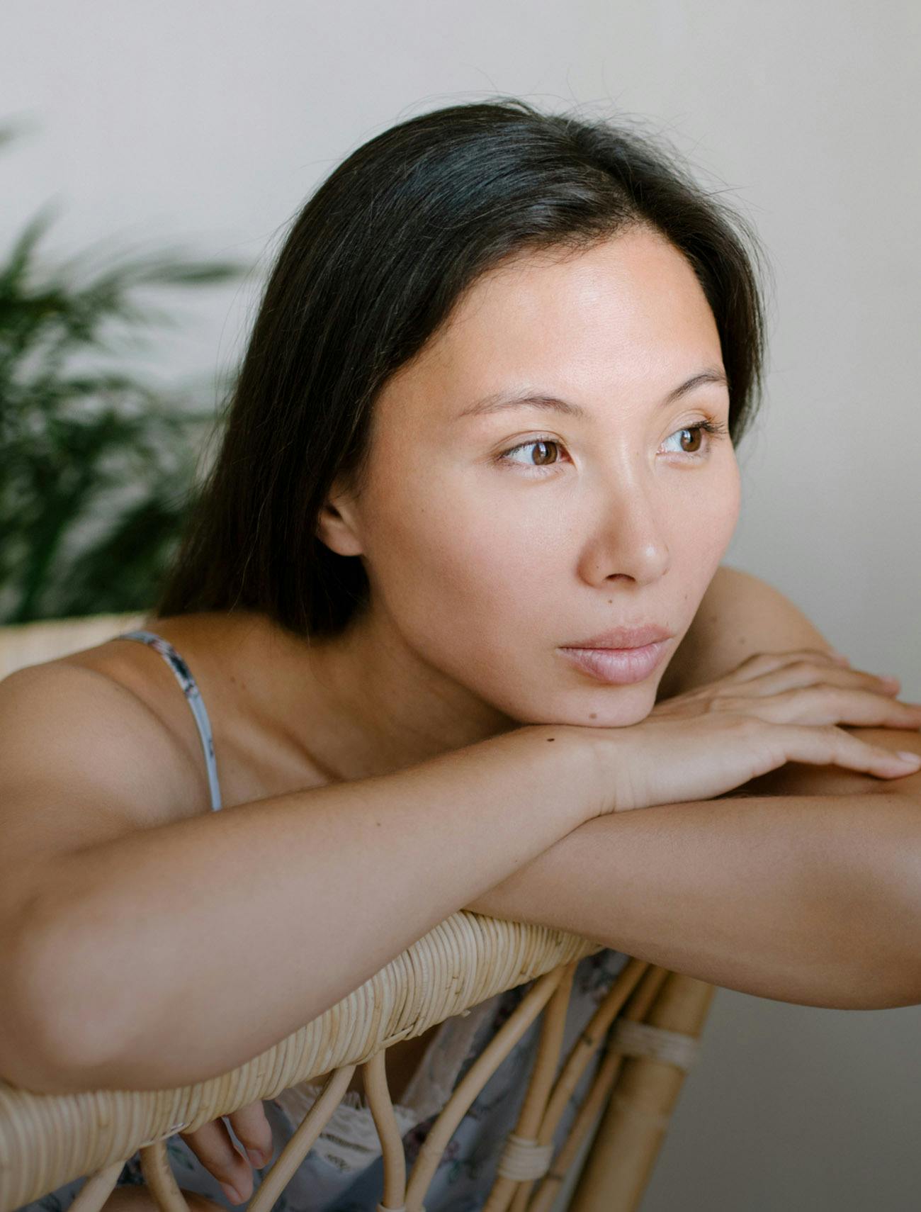 woman resting her face on her arms