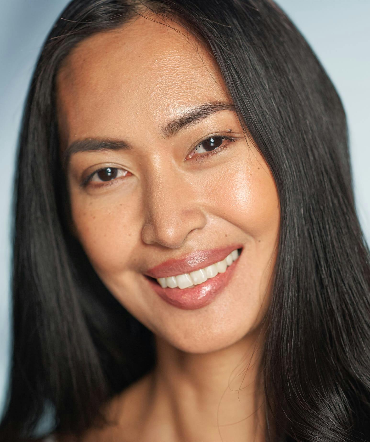 smiling woman with long black hair
