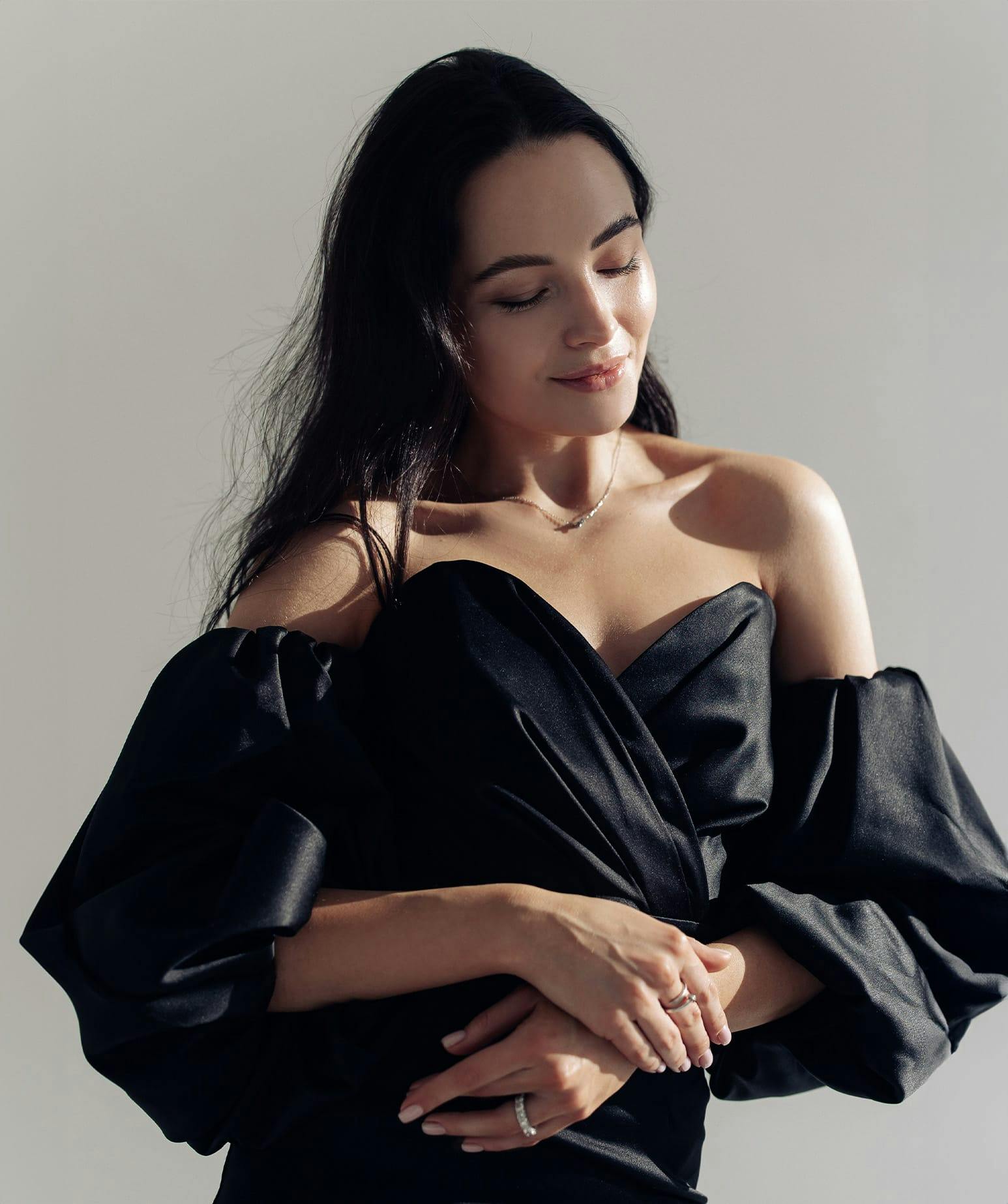 woman smiling with her eyes closed