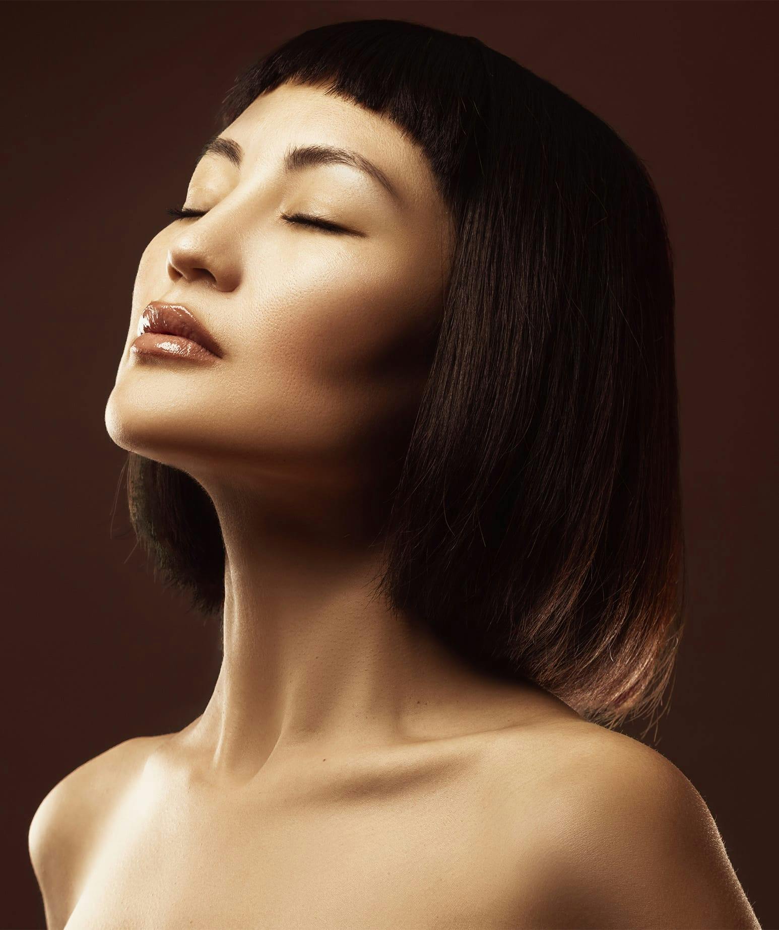 woman with her eyes closed and her head tilted up