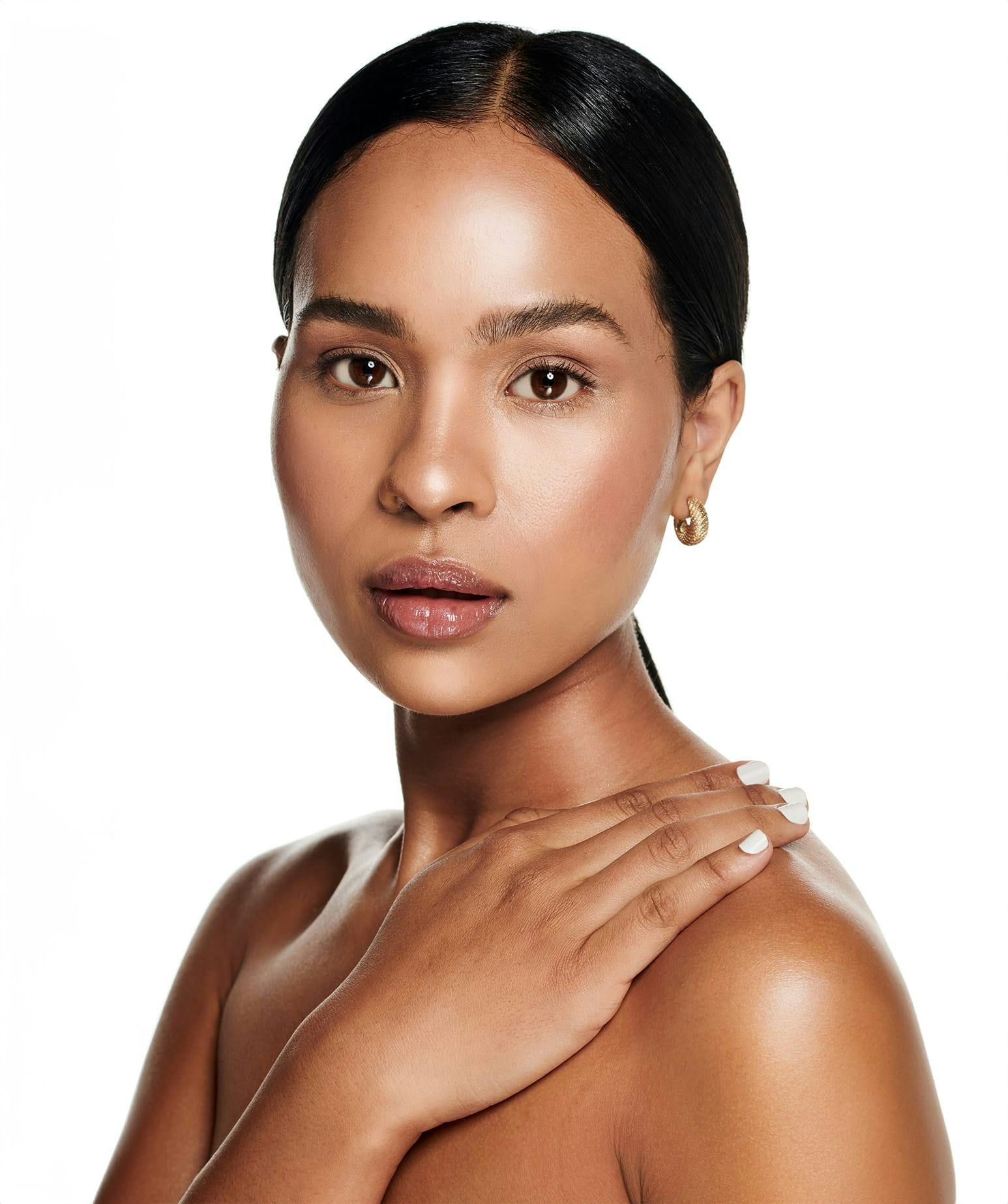 woman with her hand on her shoulder