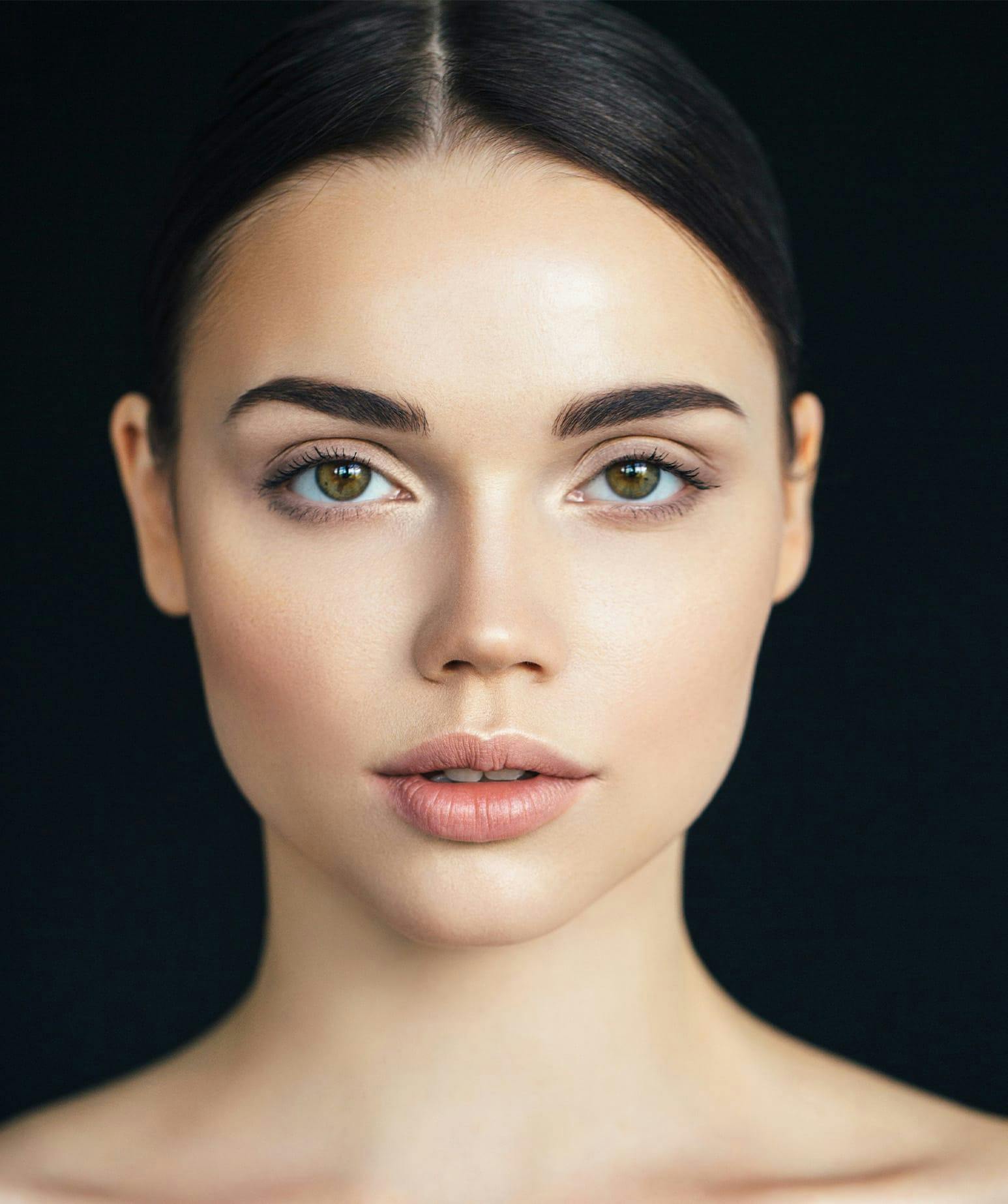 woman with slicked back hair