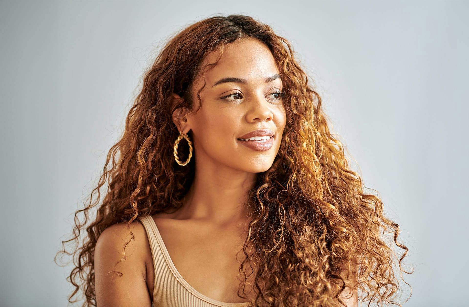 woman with long curly brown hair